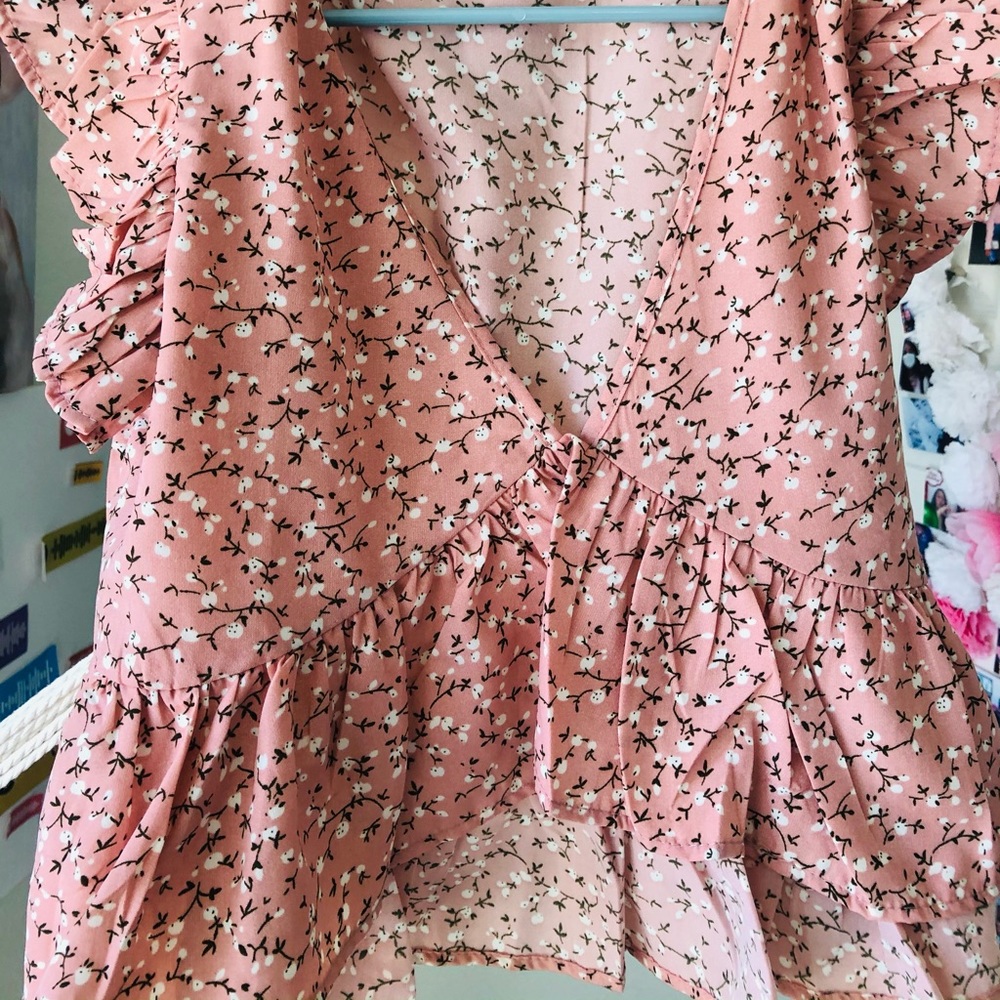 Pink shirt with ruffles